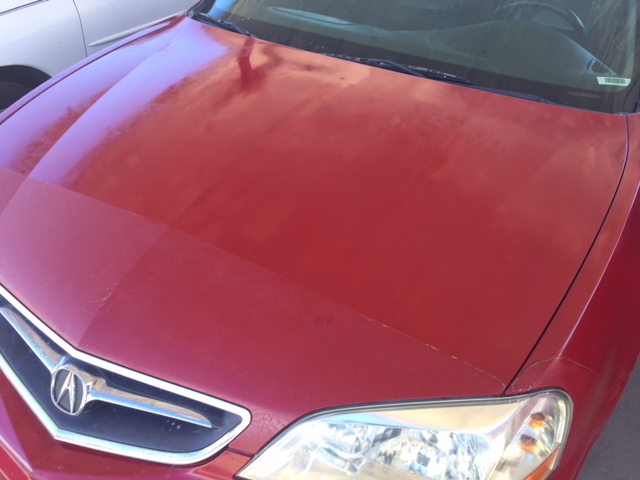 car paint oxidation. faded and oxidized car paint. Photos showing the before and after condition of the oxidized hood on a Honda Acura with faded red color and failing clear coat.